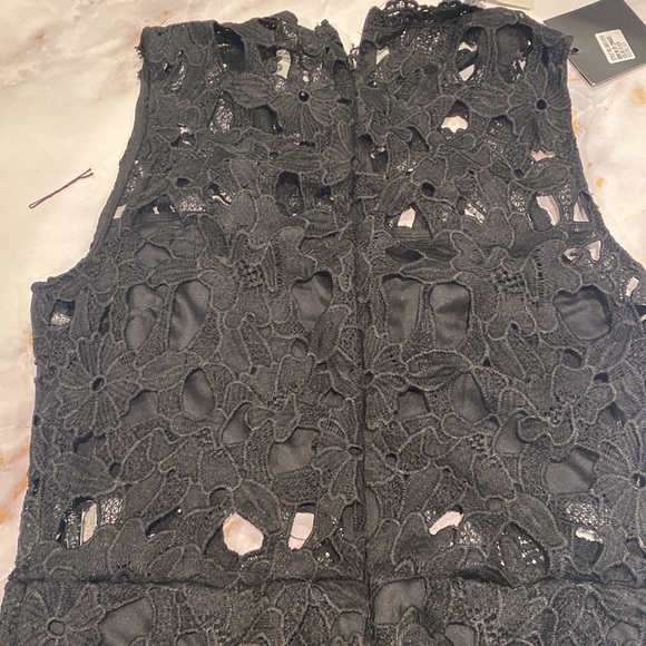 Black lace dress with cutouts. Lined bodice and bottom skirt section. SZ Us 8 - Picture 3 of 4
